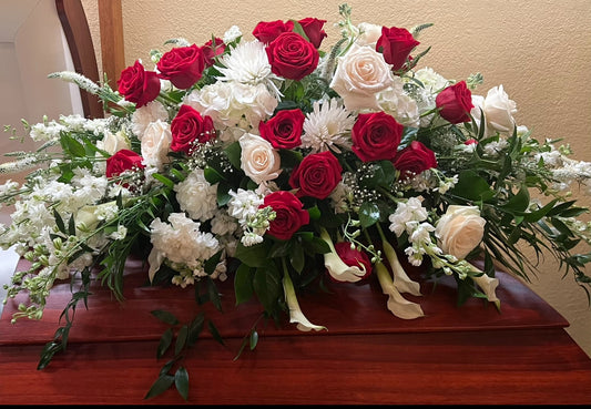 Red and White casket arrangement